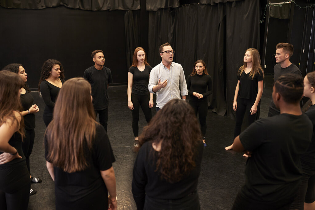 Teacher With Male And Female Drama Students At Performing Arts School In Studio Improvisation Class Escuela municipal de teatro de Guadalajara Yllana
